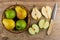 Apples, pears in wicker basket, cross section of fruits