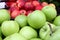 Apples. Pile of organic red apples on a farmers market. Apple background texture. Fruits wallpaper. Apples cover photo.