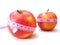 Apples with pink tape measure