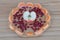 Apples and pomegranate on a wooden plate. Tangerines and pomegranate