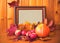 Apples, pumpkin, maple leaves and picture frame.