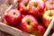 Apples. Ripe red apples in a wooden box. Red apples. Fruits.