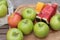 Apples and watermelon delicious on wood background.