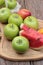 Apples and watermelon delicious on wood background.