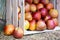 Apples In Wooden Crate, Ripe red apples in wooden box, harvest agriculture concept