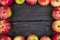 Apples on wooden table background. Fresh fruit backdrop with empty space for text