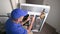 Appliance Technician Checking Voltage on an Electric Dryer