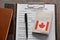 Application form, pen and a Canadian passport