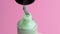 Apply light green nail polish to the brush. Run a brush along neck of the can.