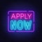 Apply Now neon sign on a brick wall background.