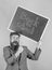 Apply for sensational educational offer. Man bearded teacher holds blackboard back to school inscription on green