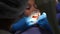 Applying mouth retractor to young male kid patient. Dental assistant places mouth safety guard or retractor on young boy