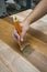 Applying protective varnish on a wooden furniture