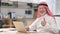 Appreciative Old Arab Businessman with Laptop doing Thumbs Up