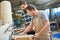 Apprentice and instructor build a wooden shelf