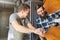 Apprentice and instructor control a wooden board