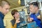 Apprentices working on machine - metal processing