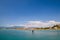 Approach of an airplane to Corfu airport in a magnificent scenery of mountains and sea, photo from behind