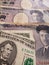approach to American banknote of five dollars and Japanese banknotes of 1000 yen