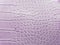 approach to leather surface in light purple color, background and texture