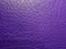 approach to leather surface in purple color, background and texture