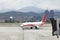 Approaching aircraft with jetbridge in Taipei Song Shan Airport