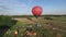 Approaching the big balloon above the center of a family vacation aerial