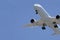 Approaching plane against a blue sky