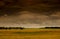 Approaching thunderstorm on background fields with harvest