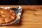 Apricot cake baked in foil on a wooden table. tasty pie food photo