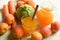 Apricot, carrot and zucchini juice in the glass with fruits and