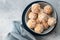 apricot coconut bliss balls in blue bowl