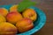 Apricots. Bowl of harvested apricots on a rustic stone surface,