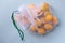 Apricots in eco-friendly packaging. Reusable bags for vegetables and fruits. Shopping in the store, retail. Eco-friendly packaging