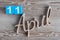 April 11th. Day 11 of april month, color calendar on wooden background. Spring time