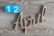 April 12th. Day 12 of april month, color calendar on wooden background. Spring time