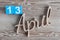 April 13th. Day 13 of april month, color calendar on wooden background. Spring time