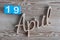 April 19th. Day 19 of april month, color calendar on wooden background. Spring time