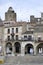 April 2, 2021 in Trujillo, Spain. Stone houses in the main square of Trujillo where the statue of Francisco Pizarro is