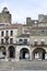 April 2, 2021 in Trujillo, Spain. Stone houses in the main square of Trujillo where the statue of Francisco Pizarro is