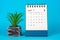 April 2024 Desk Calendar on Blue Background