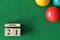 April 21, number cube with balls on snooker table, sport background.