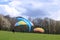 April 25 2021 - Dresden/Germany: Paragliders taking off in front of a green hill