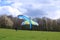 April 25 2021 - Dresden/Germany: Paragliders taking off in front of a green hill