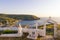 April 28th 2019 - Agios Efstratios island, Greece - The cemetery of the island, overlooking the harbor, in warm sunset colors