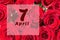 April 7th. Day of 7 month, calendar date. Natural background of red roses. A bouquet of dark red roses