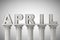 April month sign on a classic columns