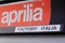 Aprilia logo sign and text front of motorcycle dealership of italian motorbike brand