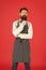 The apron is just part of my kit. Stylish waiter in elegant bow tie and bib apron. Bearded man wearing cooking apron