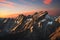 Apuane alpi snowy mountains and marble quarry at sunset in winter. Carrara, Tuscany, Italy.